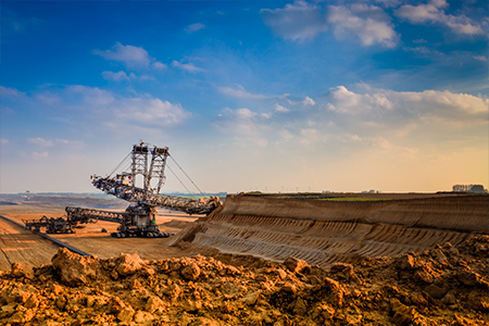 Landfill Site: Illustration of heavy machinery in action, managing waste in a rural environment